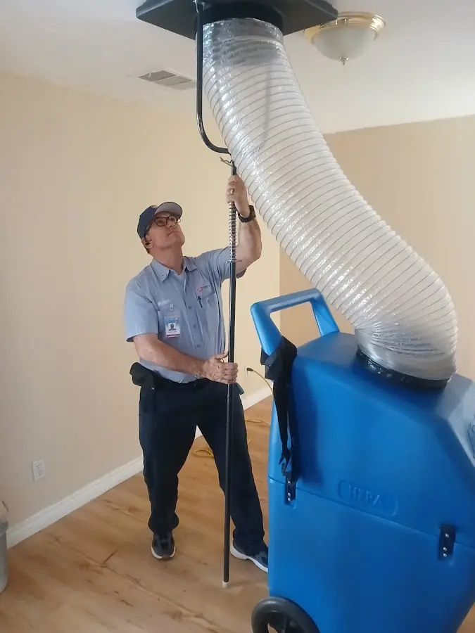 Furnace Tune-Up technician using HEPA equipment in Coon Rapids